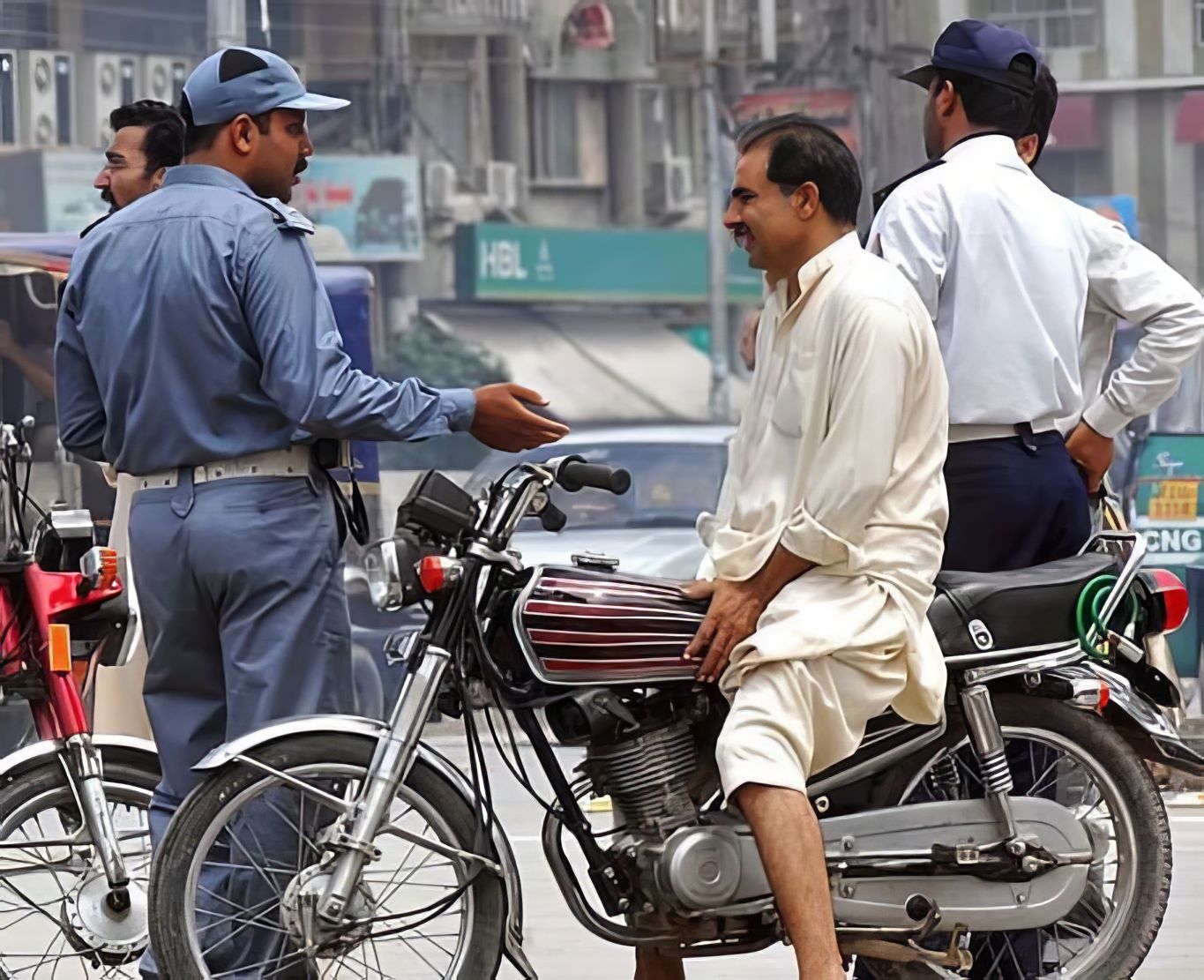 lahore's traffic boss cracks down on helmetless riders